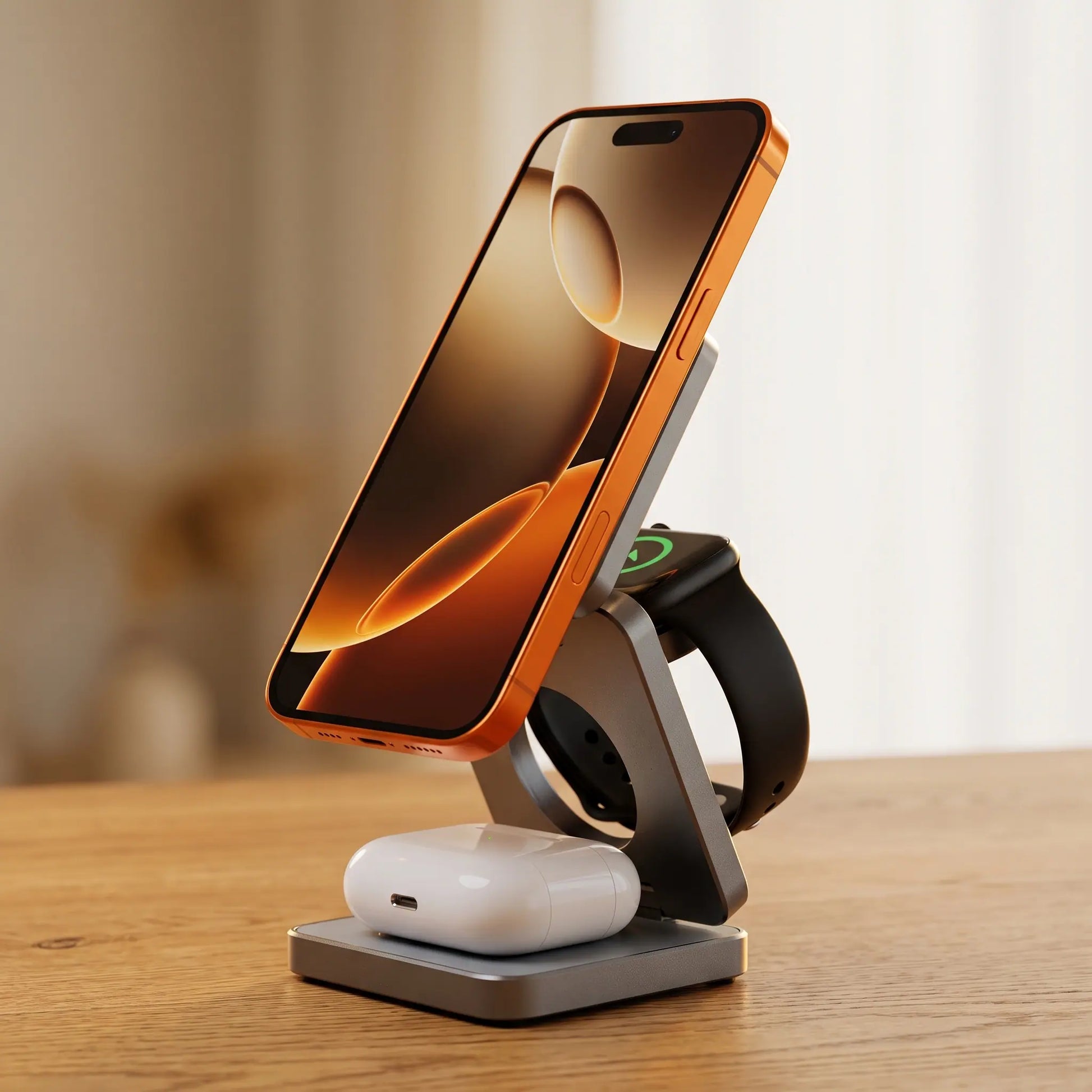 The Fold, Stone Grey, open with phone, watch and earbuds charging