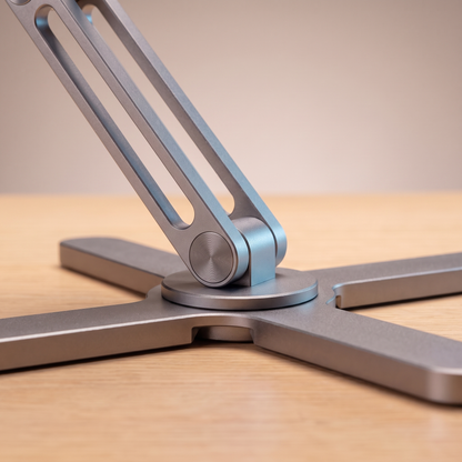 Close view of The Pivot's cross base and 360-degree swivel hub